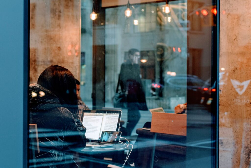Person using a computer and phone