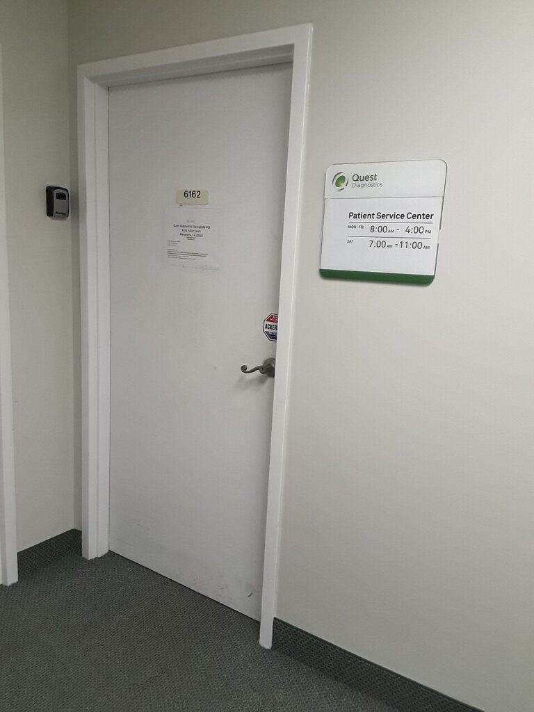 Entrance and patient service centre sign at a Quest Diagnostics office in Franconia, Virginia